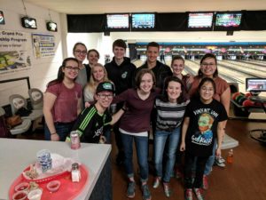 12 students in Mu Kappa at a bowling alley.  