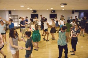 Students dance at a Coast to Coast swing dance club evening meeting