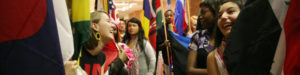 Students carrying international flags.  