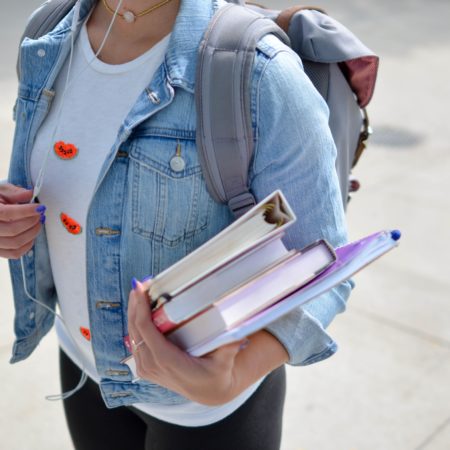 Student Carrying Textbook
